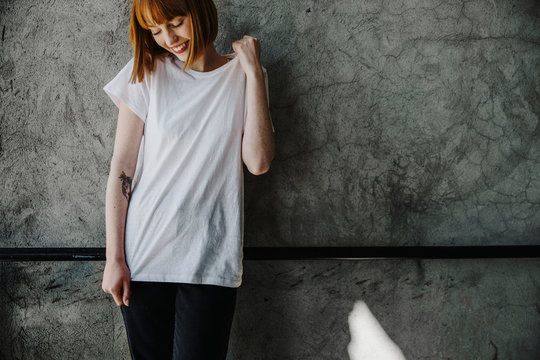 Woman wearing a white T-shirt mockup