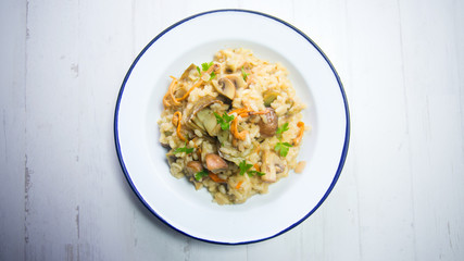 Italian Risotto with mushrooms and zucchini and artichokes