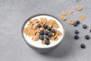 Healthy tasty breakfast. Multigrain wholewheat healthy cereals with fresh berry blueberry and yogurt.