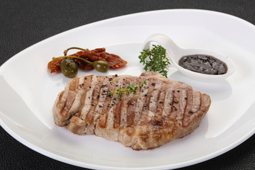 Grilled pork steak with pepper sauce