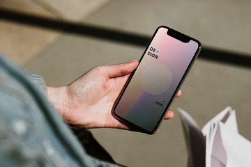 Woman staring at a smartphone screen