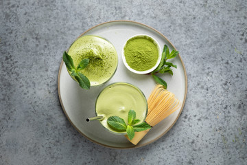 Dalgona Iced Matcha tea. Whipped white eggs with matcha tea is added to milk with ice. View from...
