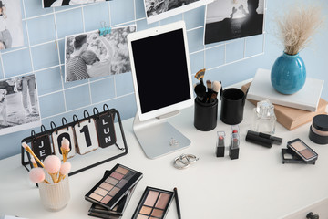 Workplace of professional makeup artist with tablet computer