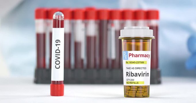 Lab tube with COVID-19 test and prescription bottle with ribavirin generic pills on the table