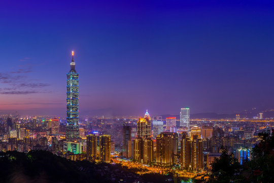 View of Taipei City skyscrapers at night from Elephant or Xiangshan mountain. Landmark of Taiwan. Cityscape in twilight time, Teipei. Taiwan