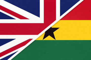 United Kingdom vs Ghana national flag from textile. Relationship between two European and African countries.