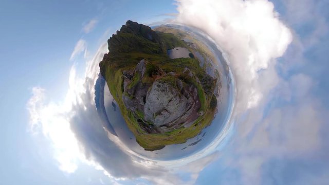 Unique little planet time-lapse showing formation of rainbow from mountain summit, 4K