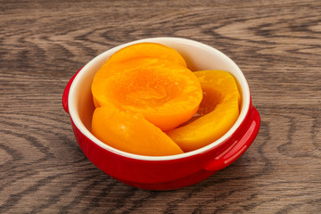 Marinated peaches fruit in the bowl
