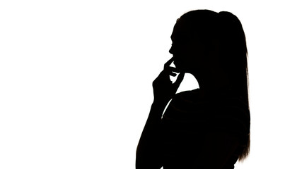 silhouette of a young thinking woman with hand near chin on a white isolated background, profile of pensive girl with handpicked hair