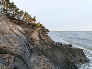 sea landscape. steep shore under the influence of rain and wind