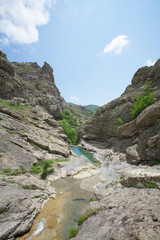 Mountain landscape with a reservoir: river or lake. Wild nature without people.