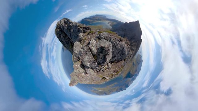 Little planet time-lapse from stunning mountain peak surrounded by small island and ocean, 4K