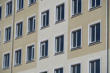 Fototapeta na wymiar facade of a new multi-storey building with many windows