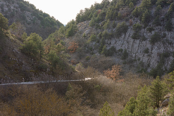 Mountain serpentine in the Crimea. Road in the mountains. Beautiful landscape with road. Landscape with forest and road on a cloudy day