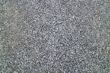 Grey gravel on the floor in the park. Background concept. Soft focus.