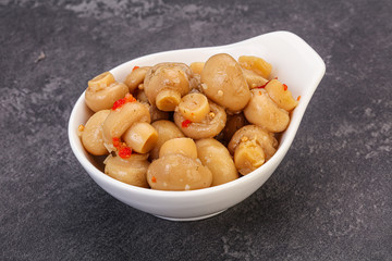 Pickled champignons in the bowl
