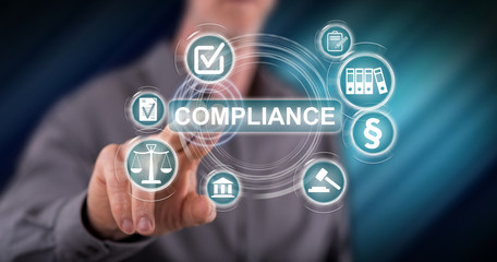 Man touching a compliance concept