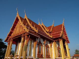 Naklejka premium Nakorn Phanom, Thailand - Nov 16th, 2019: Wat Phra That Renu Nakhon temple complex, with the elegantly designed 36 meters high and over 8 meters wide chedi dominating the area.