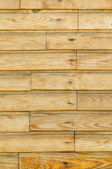 Wooden wall of light wood with horizontal lining