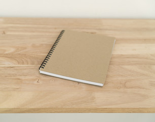 Blank catalog, magazines, book on wood background.