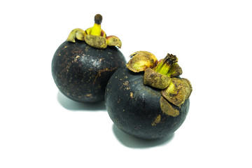two mangosteens isolated on white background