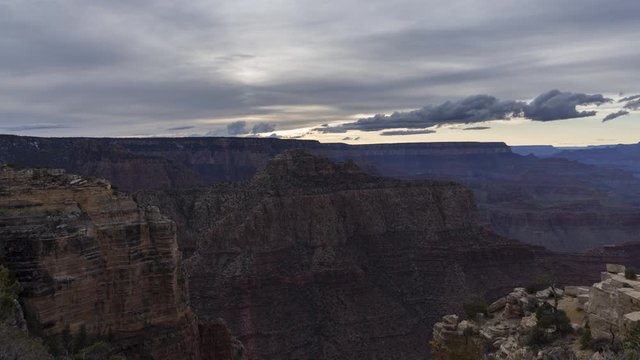 A wide sunset timelapse looking down into the Grand Canyon from Moran Point. The sky lights up with beautiful pink and orange colours shortly after sunset.
