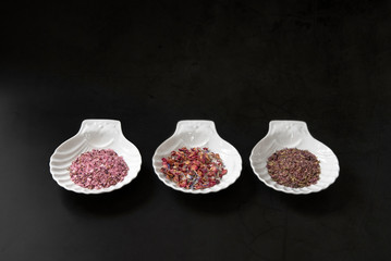 Three different types of salt, black background