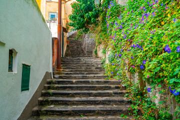 Fototapeta na wymiar Narrow stairs and streets in the tourist village of Positano, Amalfi coas