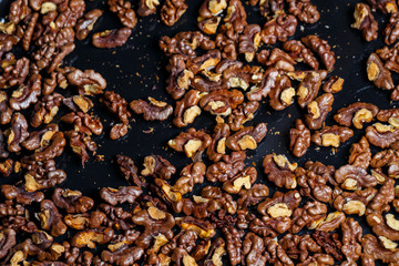  Roasted walnuts. Nuts help the brain work. Fatigue Food, Healthy Nuts. Superfood, vegan, vegetarian food concept. Macro of walnut texture, selective focus. Healthy snack.