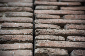 Wall of old bricks is close