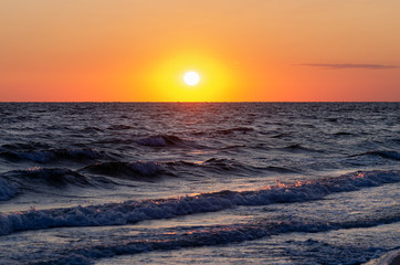 Sea waves roll ashore