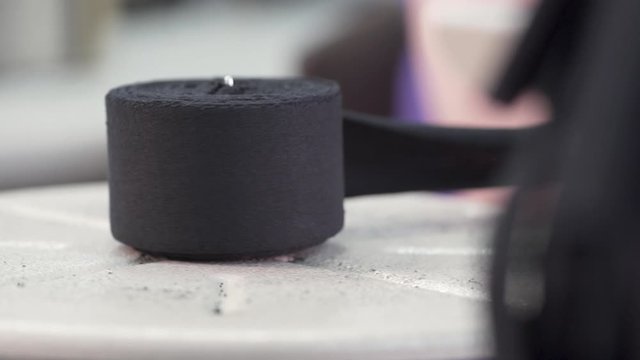 The unwinding edge of the tape in sewing, close-up