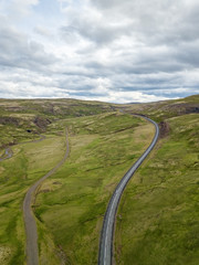 car driving on beautiful road, travel background, aerial scenic landscape from Iceland