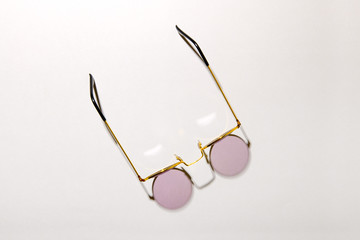 Wire rimmed glasses or shades viewed top down