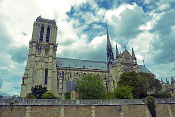 Fototapeta na wymiar Paris, France - August 2th 2014 : View of the Cathedral Notre-Dame de Paris, before the fire that destroyed the roof, the spire and a large part of the stained glass windows in the building.