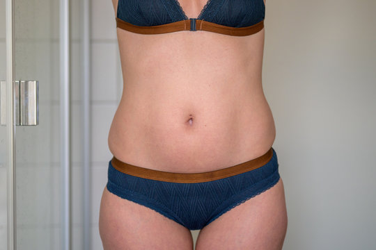 Midriff Of A Slim 38 Year Old Woman In Underwear