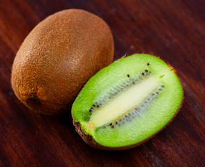 Whole and halved kiwifruits