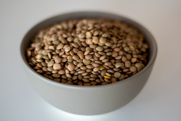 brown lentils in gray bowl