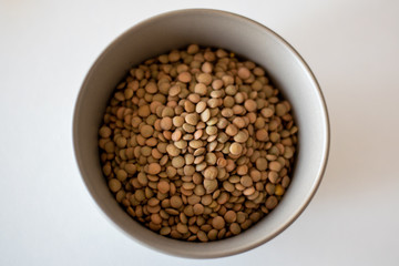 brown lentils in gray bowl