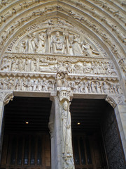 Paris, France - April 22th 2008 : Focus on the tympanum of the Sainte-Anne portal and its two lintels.