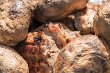 perfectly cooked barbecue potatoes and steak