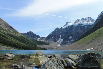 Naklejka na ściany i meble Scenic View Of Mountains And Lake Against Sky