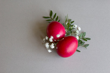 Happy easter. Colorful easter eggs. pastel Background with pink red easter eggs decorated with flowers and leaves. easter greeting card