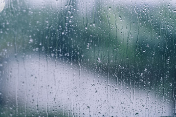 rain droplet on mirror with narrow focus in blue tone, photo may had some noise and partly blur