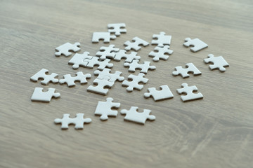 puzzle pieces on the wood table