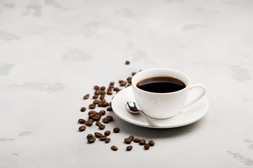 cup of black coffee on a light background