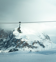 skiers on ski lift