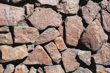 wall of large flat stones, with different colors and sizes