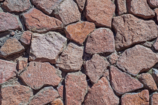 wall of large flat stones, with different colors and sizes