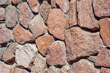 wall of large flat stones, with different colors and sizes